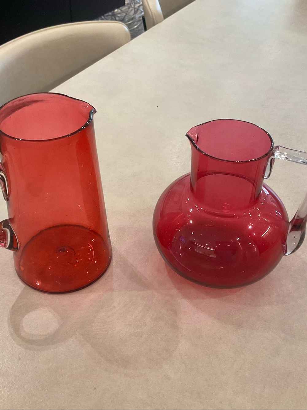Set of Two Red Glass Pitchers with Clear Handles